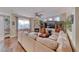 Light-filled living room with a cozy fireplace and hardwood floors, perfect for relaxation at 784 Tossa De Mar Ave, Henderson, NV 89002