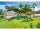 Attractive community signage and landscaping welcomes residents and guests to Palm Hills under a beautiful sky at 784 Tossa De Mar Ave, Henderson, NV 89002