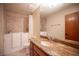 This bathroom features a granite vanity, walk-in tub, toilet, and tile flooring at 7913 Sailboat Ln, Las Vegas, NV 89145