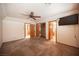 This bedroom features neutral walls and carpet, closet with mirrored doors, and multiple doorways at 7913 Sailboat Ln, Las Vegas, NV 89145