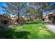 Picturesque greenbelt view with mature trees and a stream at 7913 Sailboat Ln, Las Vegas, NV 89145