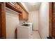This laundry room features a washer, dryer, and overhead storage at 7913 Sailboat Ln, Las Vegas, NV 89145