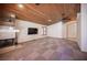 Inviting living space featuring a fireplace, TV, and wood-paneled ceiling at 7913 Sailboat Ln, Las Vegas, NV 89145
