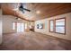 Bright living room boasts wood ceilings, fireplace and multiple windows at 7913 Sailboat Ln, Las Vegas, NV 89145