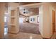 Open-concept living room with wood ceilings, fireplace, and natural light at 7913 Sailboat Ln, Las Vegas, NV 89145