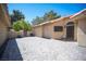 Beautiful tiled private front patio area with block fencing and front door at 7913 Sailboat Ln, Las Vegas, NV 89145