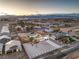 Aerial view of home highlighting neighborhood, large lot, desert landscaping and mountain views at 8645 Edmond St, Las Vegas, NV 89139
