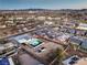 Aerial view showcasing pool, turf, oversized lot, landscaping, neighborhood, and city views at 8645 Edmond St, Las Vegas, NV 89139