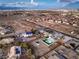 Aerial view showcasing pool, oversized lot, landscaping, neighborhood, and city skyline at 8645 Edmond St, Las Vegas, NV 89139