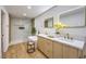 Bright bathroom showcasing a double vanity, freestanding tub, and a walk-in shower with contemporary design at 8645 Edmond St, Las Vegas, NV 89139