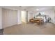 Bedroom with tan carpet, closet, with two chairs next to the bed at 8645 Edmond St, Las Vegas, NV 89139