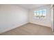 Neutral bedroom featuring carpet, white walls, a closet, and a window with view at 8645 Edmond St, Las Vegas, NV 89139
