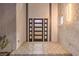 Modern front door with sidelights and a textured wall at 8645 Edmond St, Las Vegas, NV 89139
