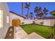 Lovely courtyard featuring manicured landscaping and a wooden gate at 8645 Edmond St, Las Vegas, NV 89139