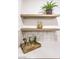Close up of the white countertop, backsplash, wood shelves, and decor to stage the space at 8645 Edmond St, Las Vegas, NV 89139