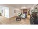 Spacious living room with wood floors, modern decor, natural light, and view to other rooms at 8645 Edmond St, Las Vegas, NV 89139