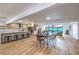 Open-concept living area with a dining space, modern kitchen, and access to the backyard pool at 8645 Edmond St, Las Vegas, NV 89139