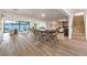 Spacious living area featuring wood floors, modern lighting, and an open-concept design at 8645 Edmond St, Las Vegas, NV 89139