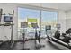 Bright gym with exercise equipment and a view overlooking the outdoor pool at 900 Las Vegas Blvd # 903, Las Vegas, NV 89101