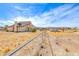 Backyard featuring an extended desert landscape and chain link fence at 9010 W Lone Mountain Rd, Las Vegas, NV 89129