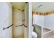 Shower and tub area with grab bars for accessibility, set in a tiled bathroom at 9010 W Lone Mountain Rd, Las Vegas, NV 89129