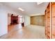 The bonus room is adjacent to the living room with wood built-ins and views of the fireplace at 9010 W Lone Mountain Rd, Las Vegas, NV 89129