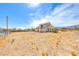 Exterior view of property with desert landscape, fencing, and mountain views in the background at 9010 W Lone Mountain Rd, Las Vegas, NV 89129