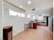 Kitchen featuring tile flooring, red and white cabinets, and plenty of natural light at 9010 W Lone Mountain Rd, Las Vegas, NV 89129