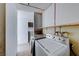 Laundry room features a washing machine, dryer and wood shelves at 9010 W Lone Mountain Rd, Las Vegas, NV 89129