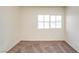 Bright, carpeted bedroom with one window at 9776 Whitewater Canyon Ct, Las Vegas, NV 89183
