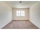 Neutral bedroom with carpet flooring, a window that provides natural light, offering a cozy and inviting space at 9776 Whitewater Canyon Ct, Las Vegas, NV 89183