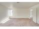 Expansive bedroom with neutral carpet, a single window, and an open doorway to the stairs at 9776 Whitewater Canyon Ct, Las Vegas, NV 89183