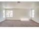 Bright bedroom with neutral carpet, ample natural light from large windows at 9776 Whitewater Canyon Ct, Las Vegas, NV 89183