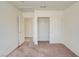 Bedroom featuring neutral carpet, standard closet with sliding doors, and bright white paint at 9776 Whitewater Canyon Ct, Las Vegas, NV 89183