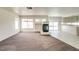 Open living area with fireplace and seamless access to the kitchen at 9776 Whitewater Canyon Ct, Las Vegas, NV 89183