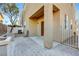 View of backyard featuring pavers and tall beige walls at 7506 Village Mist Ln, Las Vegas, NV 89113