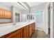 Spacious bathroom showcasing a long double vanity, bright lighting, and access to closet and shower area at 7506 Village Mist Ln, Las Vegas, NV 89113