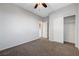 Neutral bedroom with ceiling fan and closet at 7506 Village Mist Ln, Las Vegas, NV 89113