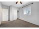 Bright bedroom with carpet, ceiling fan, and closet at 7506 Village Mist Ln, Las Vegas, NV 89113