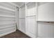 Walk-in closet with shelving units providing ample storage and organization space at 7506 Village Mist Ln, Las Vegas, NV 89113