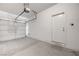 Clean garage with automatic door opener, ready for parking or storage at 7506 Village Mist Ln, Las Vegas, NV 89113