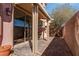 Covered patio with pavers and stucco wall, desert plants and outdoor grill at 8307 Amtrak Express, Las Vegas, NV 89131