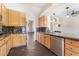 Well-appointed kitchen with light wood cabinets, dark countertops, and stainless steel appliances at 10024 Skipper Ct, Las Vegas, NV 89117