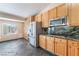 Charming kitchen with stainless steel appliances, bright wood cabinetry, and stone countertops at 10024 Skipper Ct, Las Vegas, NV 89117