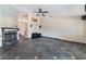 Spacious living room boasts a fireplace, stylish tile flooring, and a ceiling fan for added comfort at 10024 Skipper Ct, Las Vegas, NV 89117