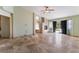 Bright living room featuring a fireplace, access to the outside, and neutral tile flooring throughout at 10024 Skipper Ct, Las Vegas, NV 89117