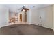 Open living space featuring a wooden railing and stair access, with carpet flooring at 10024 Skipper Ct, Las Vegas, NV 89117