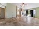 Spacious living room featuring tile flooring, a fireplace, and sliding glass doors to the outside at 10024 Skipper Ct, Las Vegas, NV 89117