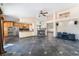 Spacious living room and kitchen area, featuring a fireplace and stainless steel appliances at 10024 Skipper Ct, Las Vegas, NV 89117