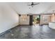 Open-concept living space with a ceiling fan and access to the backyard at 10024 Skipper Ct, Las Vegas, NV 89117